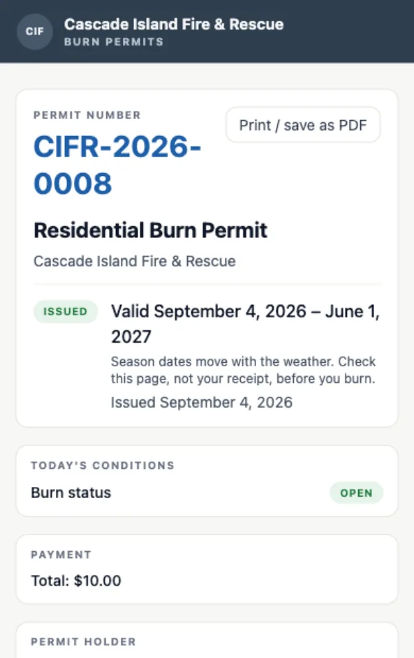 A phone showing an issued residential burn permit with its number, the dates it is valid, today's burn status, and what was paid.